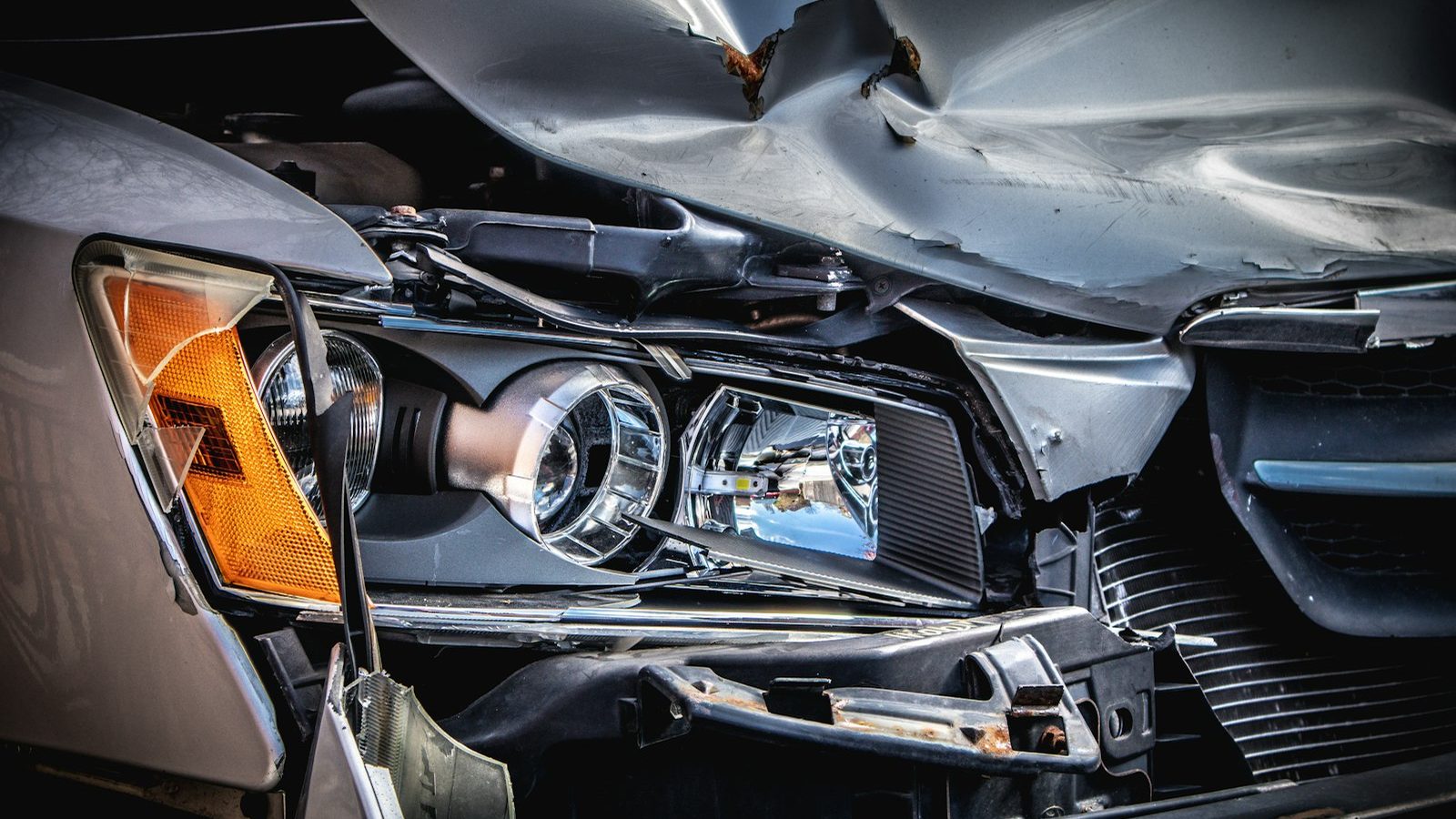 The crushed front end of a car after a collision